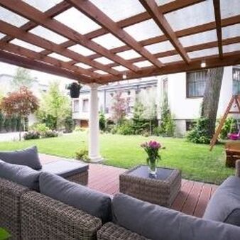 An outdoor seating area sunder a pergola in Leicester