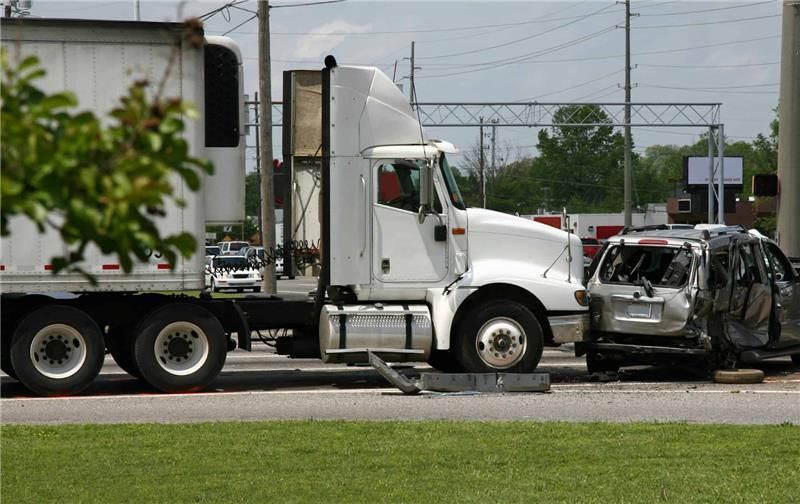 “Severe truck and SUV collision at an intersection involving a semi-truck and heavily damaged vehicl