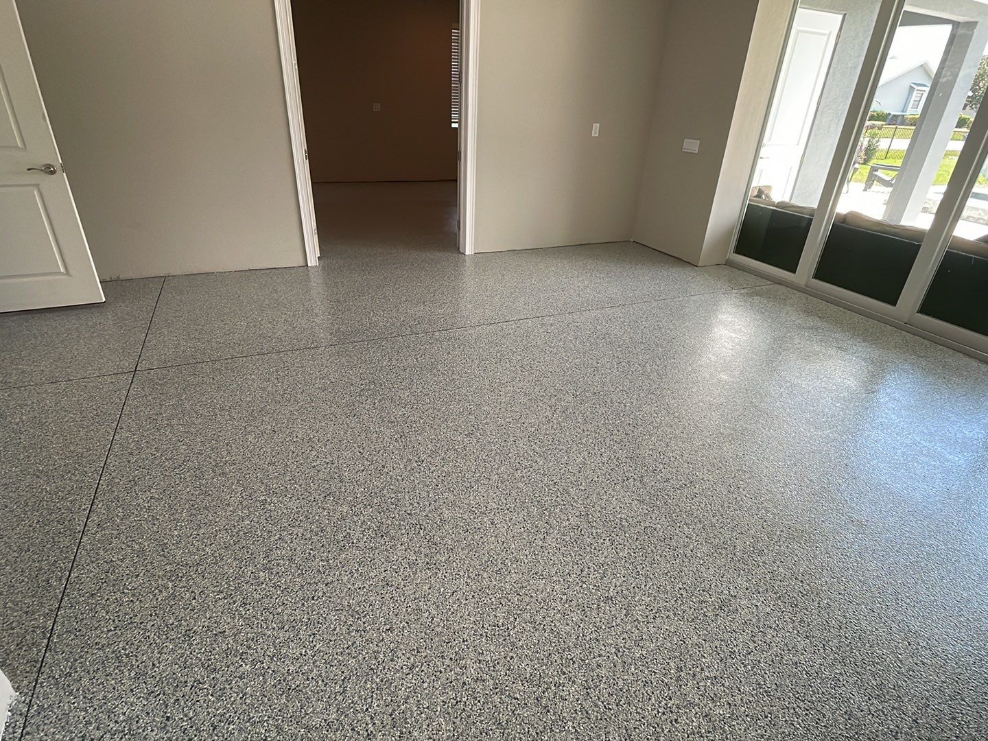 interior room after concrete coating has been applied to previously bare concrete floor