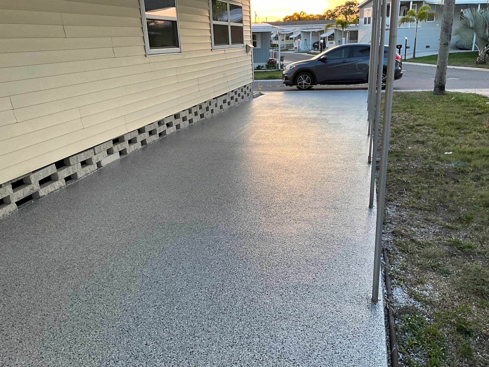 Gleaming and clean driveway with newly applied concrete coating 