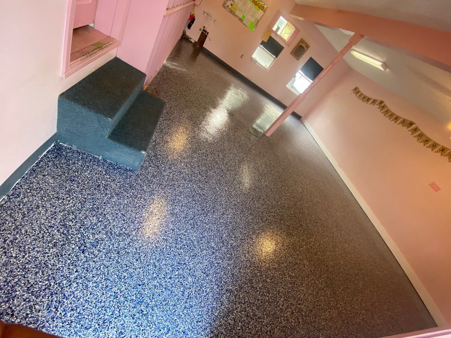 Room in childcare facility with new concrete coating on floor