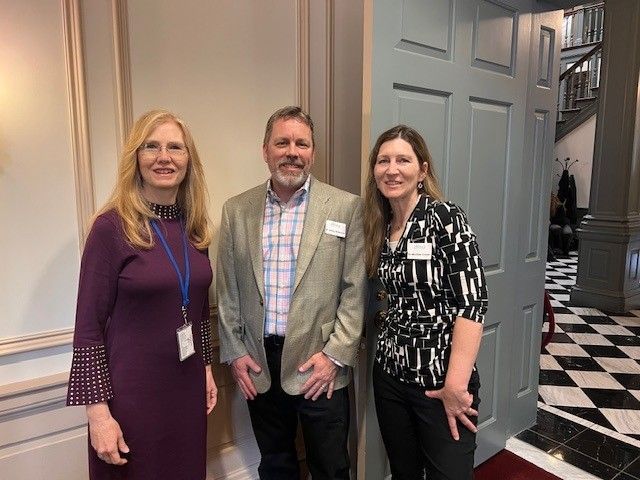 two men are posing for a picture and one has a mustache