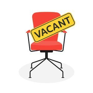 a woman with long red hair is smiling in front of a blue wall .