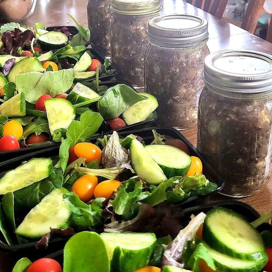 image of food prepped in bell jars including veggies and lentils