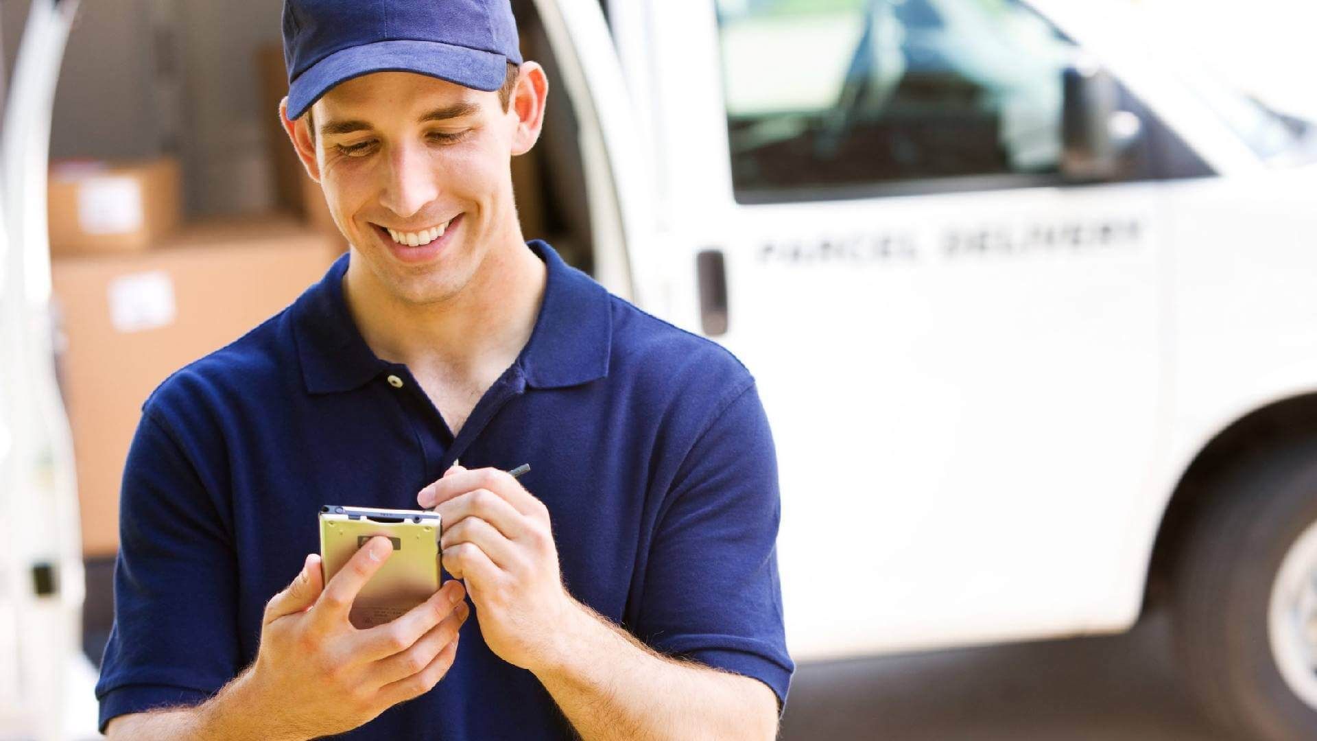 Man Hand Accepting A Delivery Boxes From Deliveryman At Home