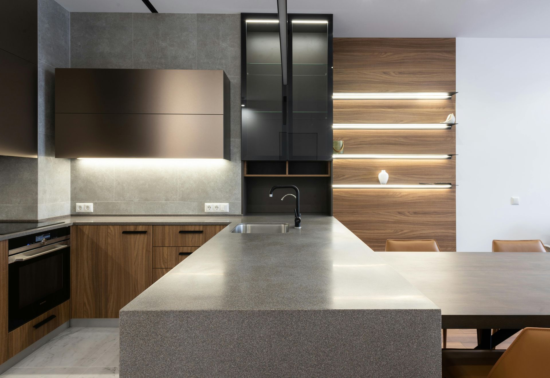 A kitchen with a large island in the middle of the room.