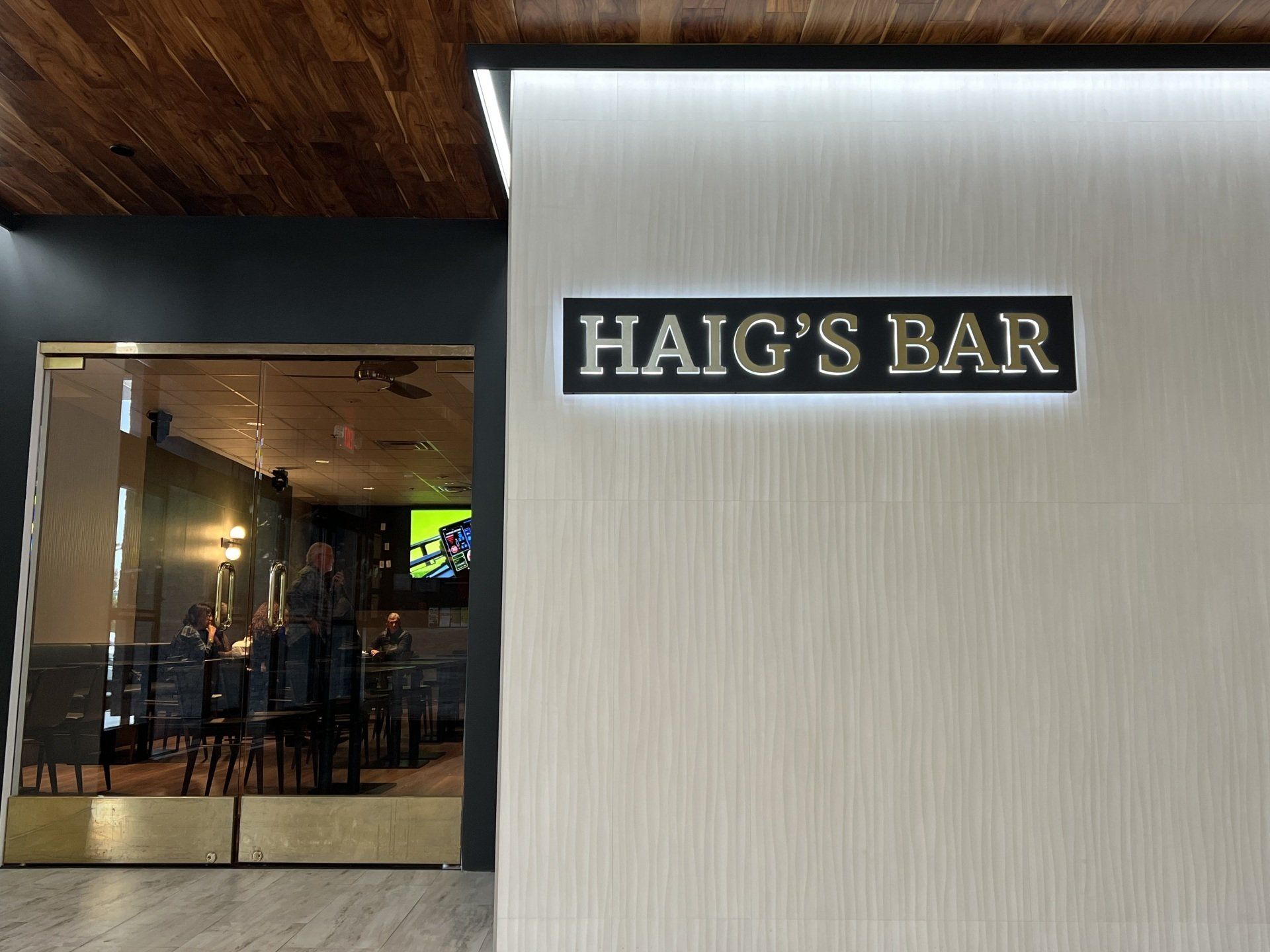 A sign that says Haig's Bar