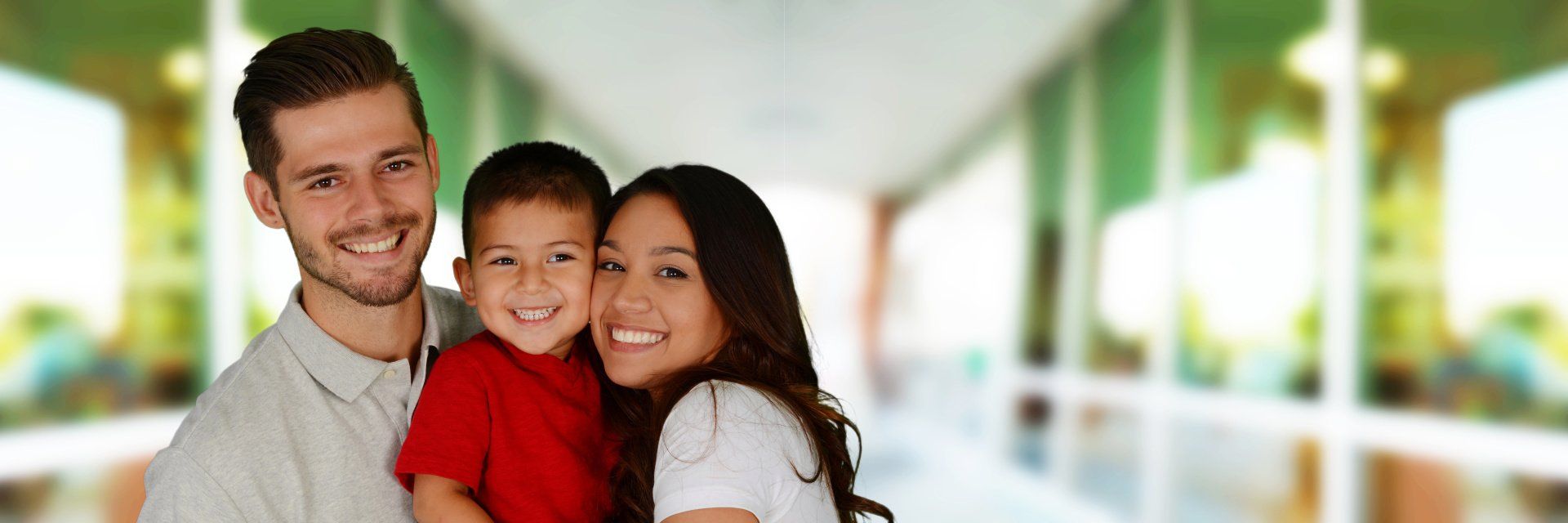 Family of three smiling