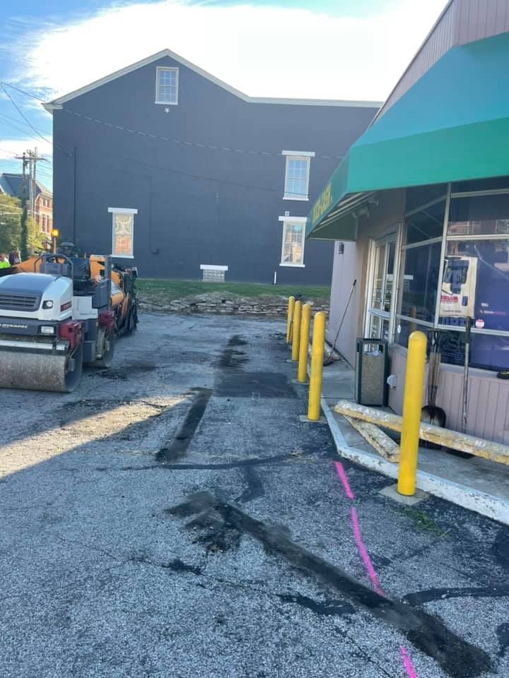 A large building with a green awning is being remodeled