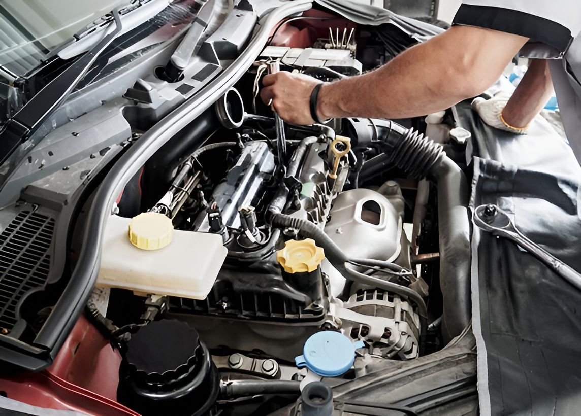 A Man is Repairing the Car’s Engine — One Stop Service and Suspension Centre In Port Macquarie, NSW
