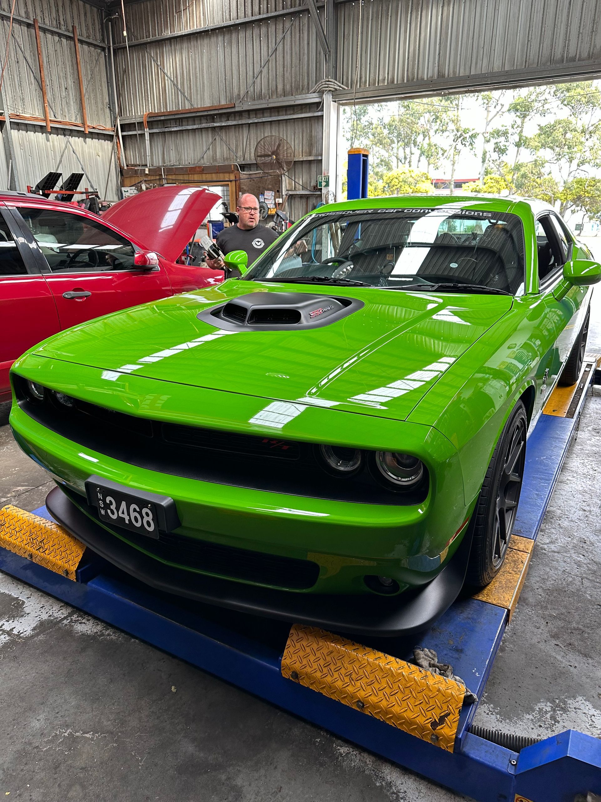 Green car the Side is Parked in a Garage — One Stop Service and Suspension Centre In Port Macquarie, NSW
