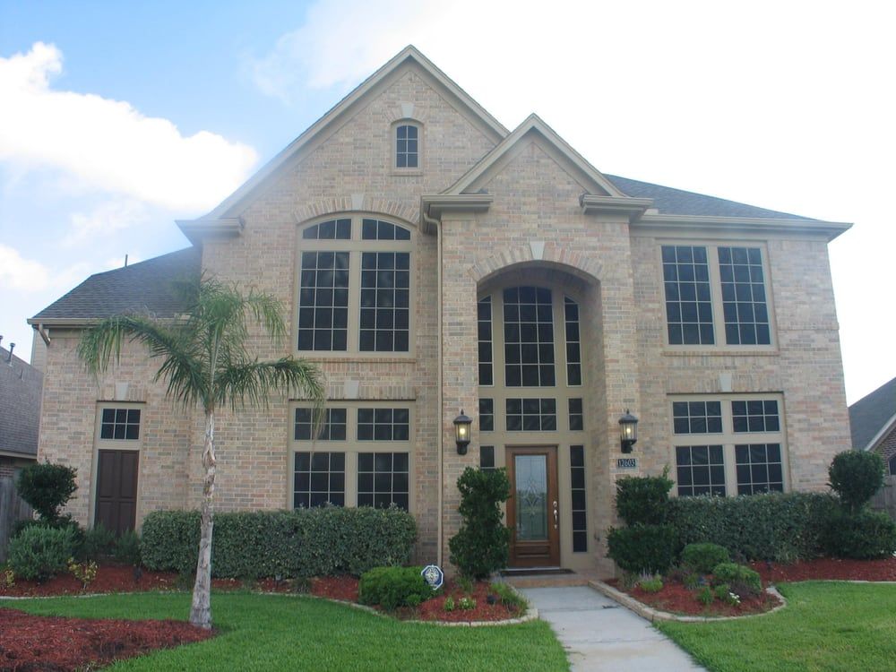 A large brick house with a lot of windows