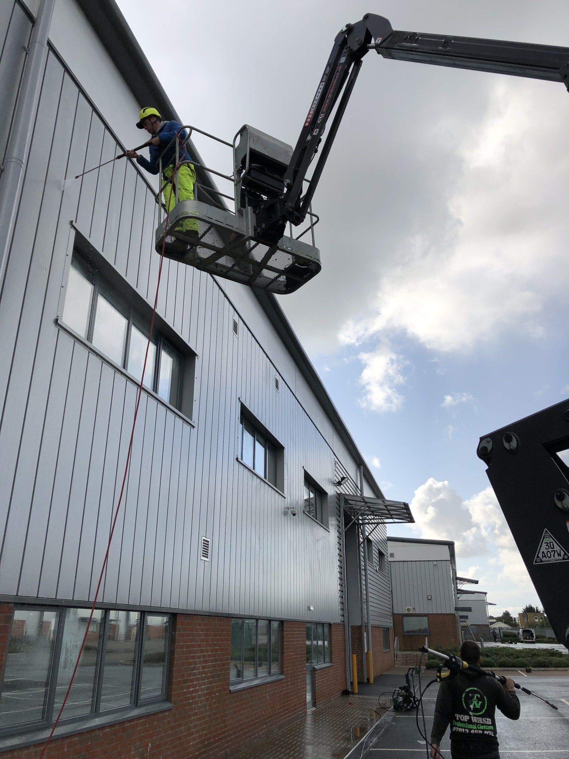 A green brush cleaning a bungalow