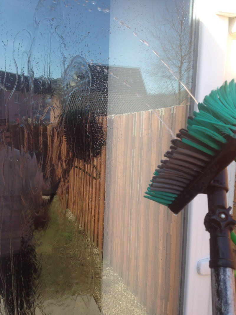 A close up of a window cleaning brush