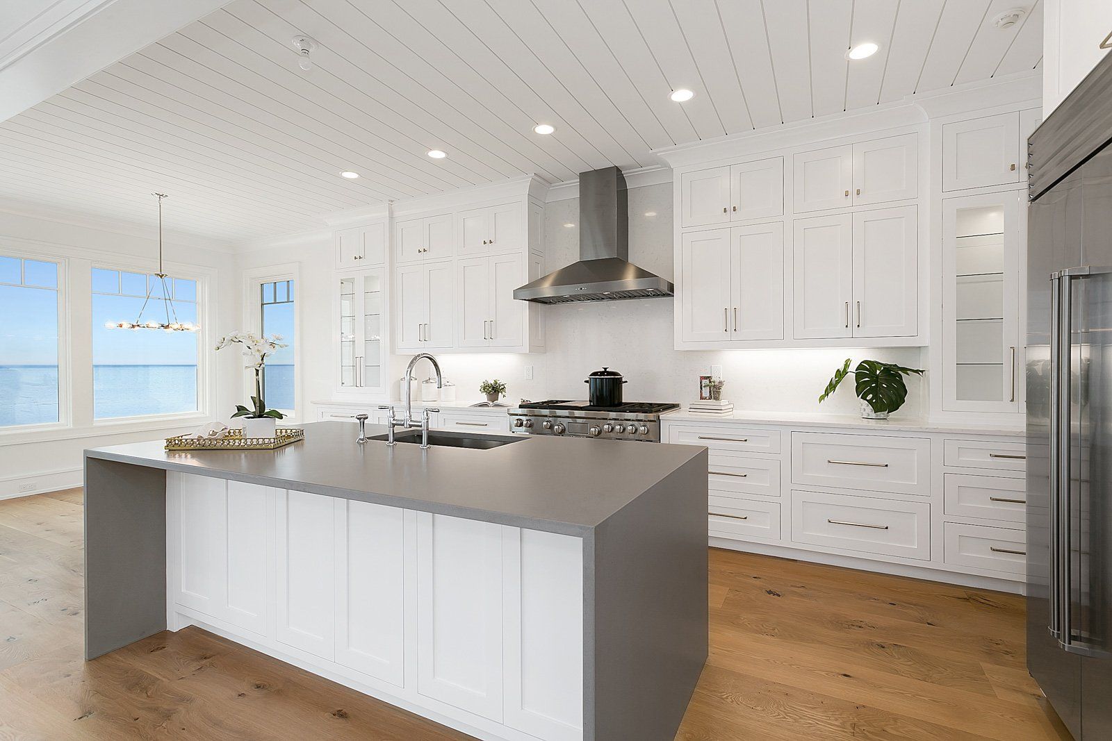 White Custom Kitchen & Gray Waterfall Countertop  | Custom Kitchen Cabinets | Domestic Kitchen Inc.
