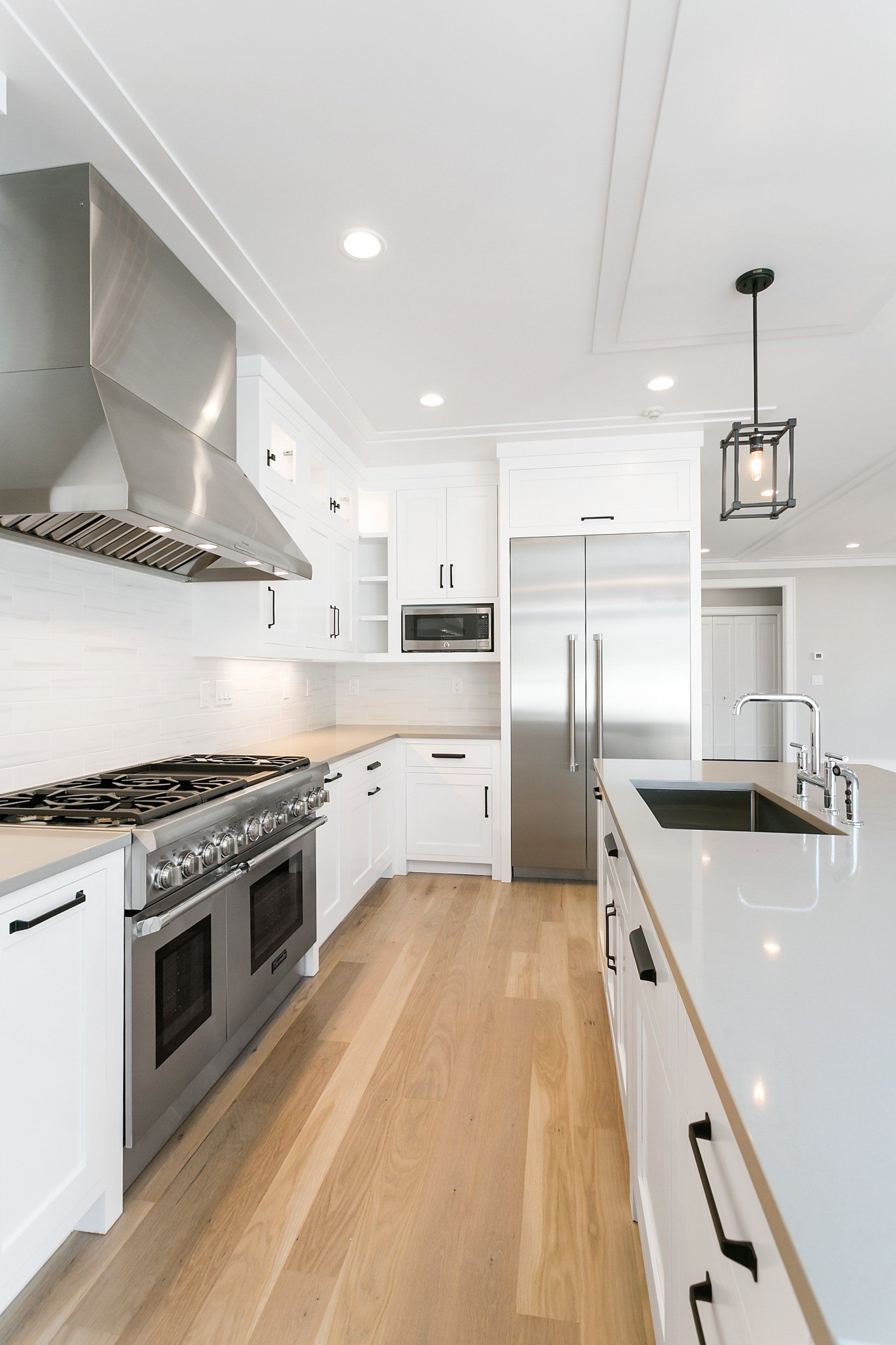 White Kitchen Cabinets & Gas Range with Silver | Custom Kitchen Cabinets | Domestic Kitchen Inc.