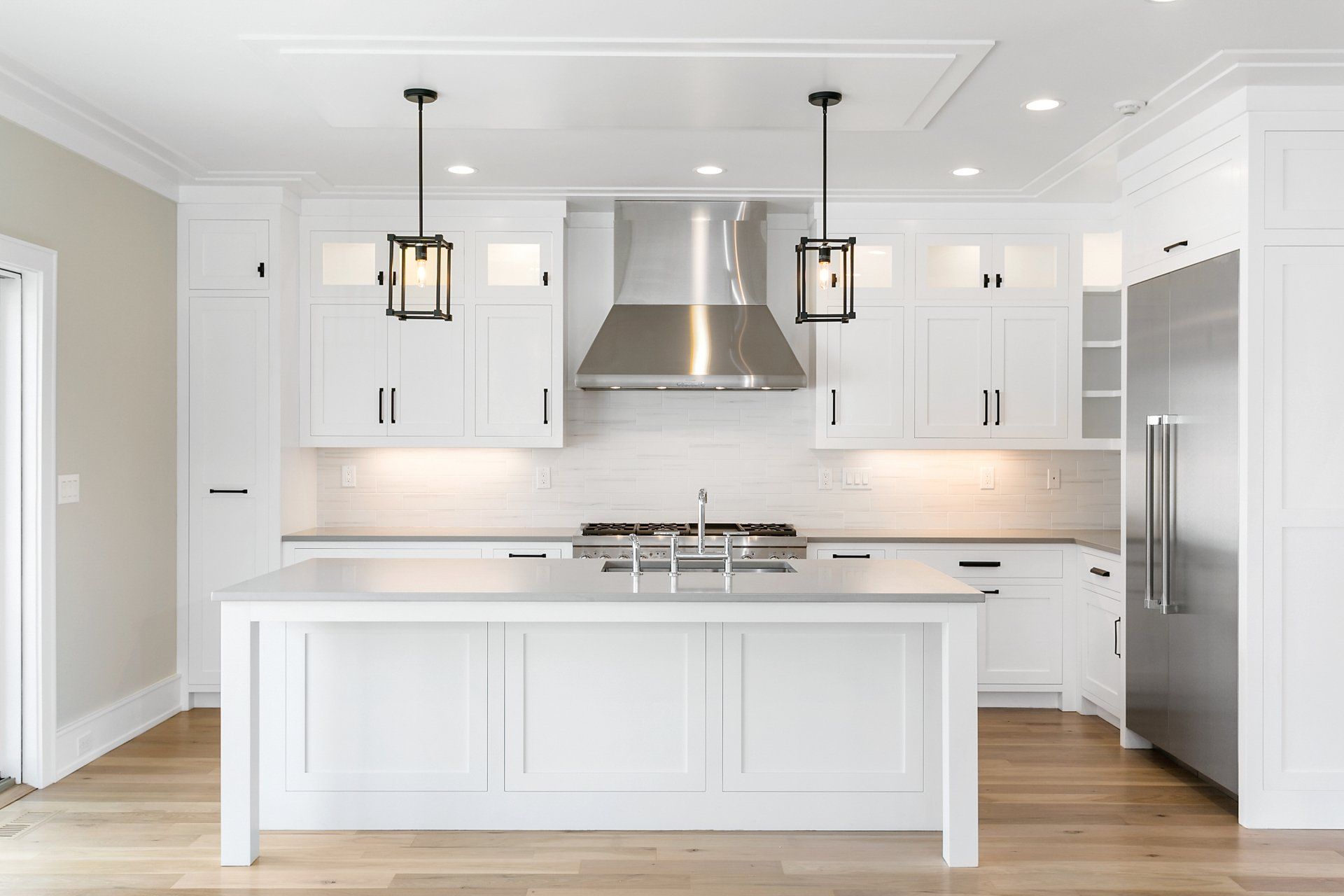 White Cabinets & White Backsplash | Custom Kitchen Cabinets | Domestic Kitchens Inc.