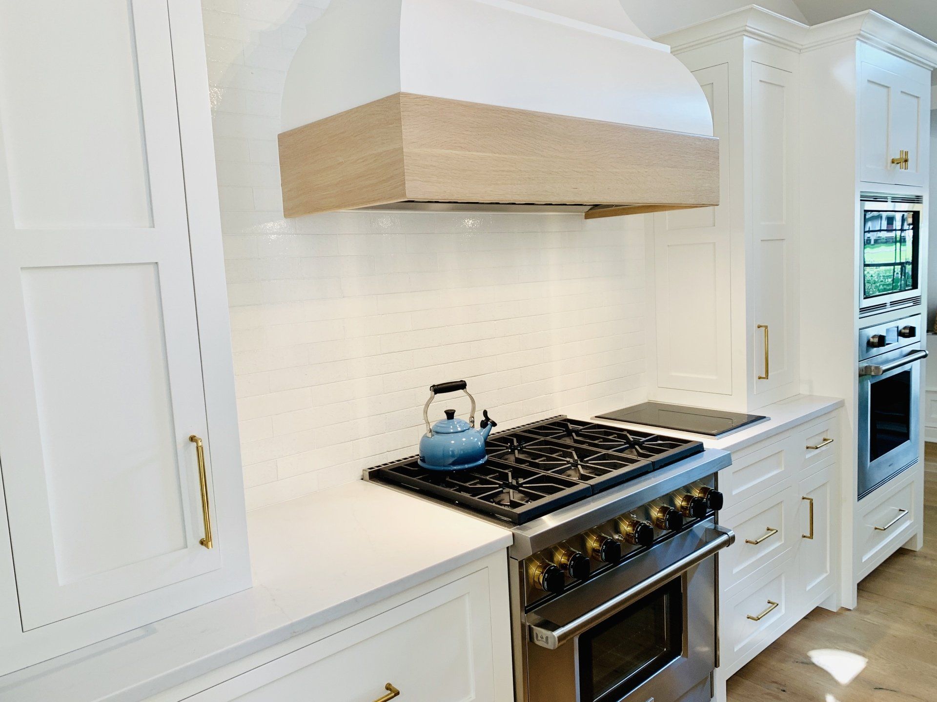 White Cabinets & White Backsplash | Custom Kitchen Cabinets | Domestic Kitchens Inc.