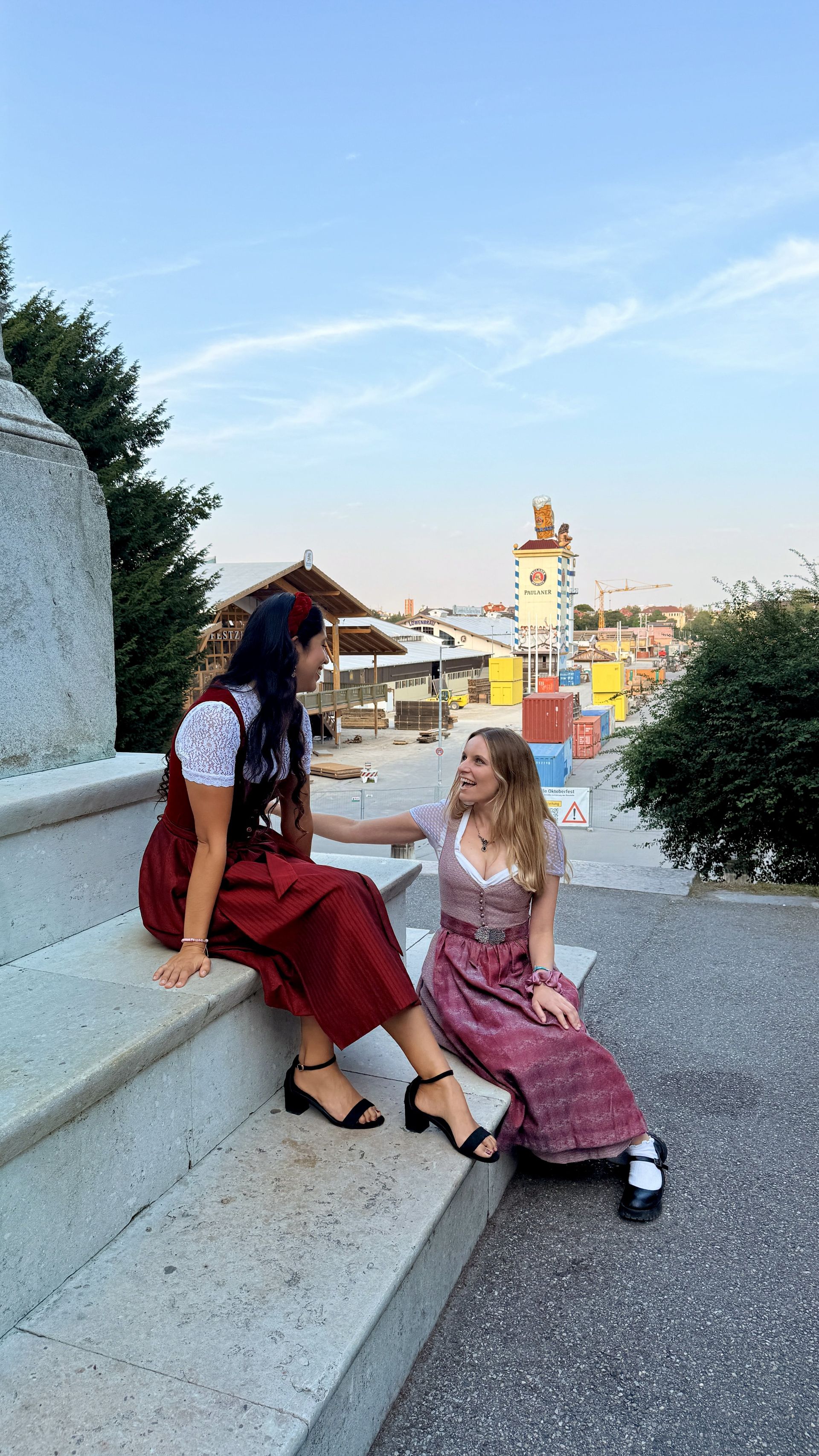 two girls in front of the Oktoberfest in dirndl