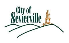 The city of sevierville logo is a drawing of a tower on top of a hill.