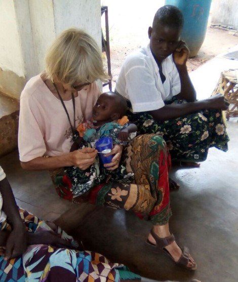 S. Lenodia Melz assisting a baby at the Nutrition Center at our Mission in Nipepe, Mozambique.