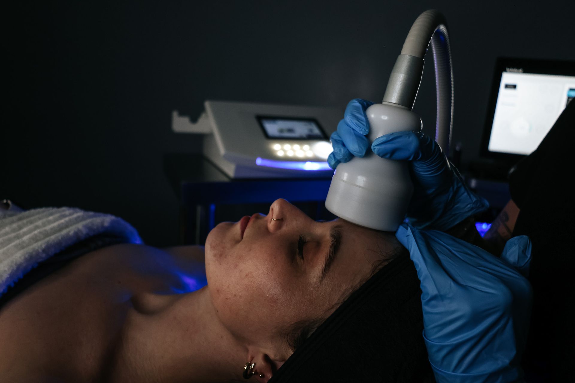 A woman is getting a facial treatment at a spa.