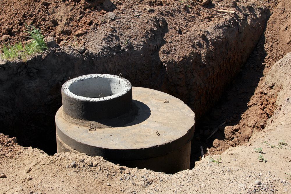 Concrete Well Partially Buried in a Dirt Pit, Likely for Septic or Drainage — Tyzac Group in Beerwah, QLD