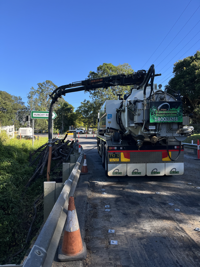 A Large Truck Pumping Something From a Bridge — Tyzac Group in Moreton Bay, QLD