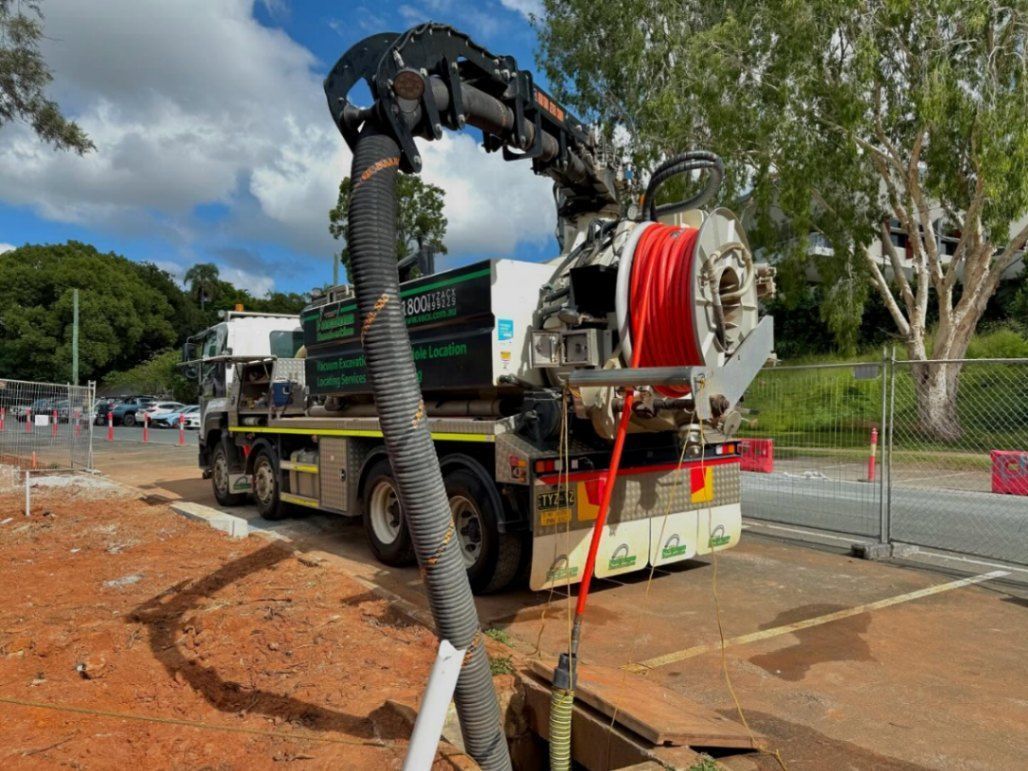Truck With Large Arm, Black Hose — Tyzac Group in Beerwah, QLD