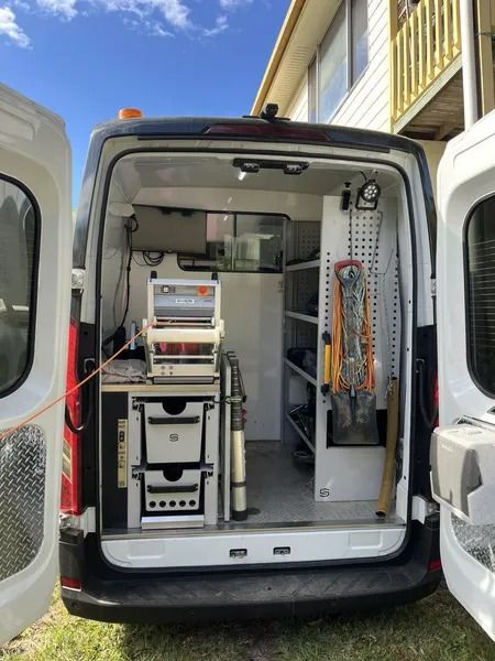 Open Back of a Service Van Reveals Shelves — Tyzac Group in Beerwah, QLD