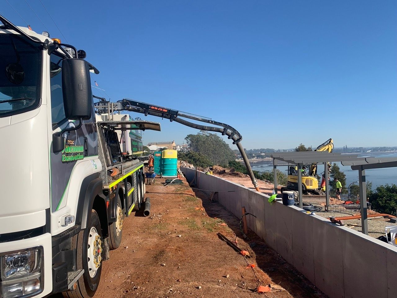 Concrete Pump Truck Pouring Concrete Into a Construction Site Retaining Wall, — Tyzac Group in Beerwah, QLD
