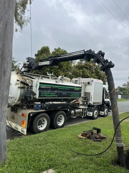Septic Tank Truck Servicing a Manhole on a Grassy Roadside — Tyzac Group in Beerwah, QLD