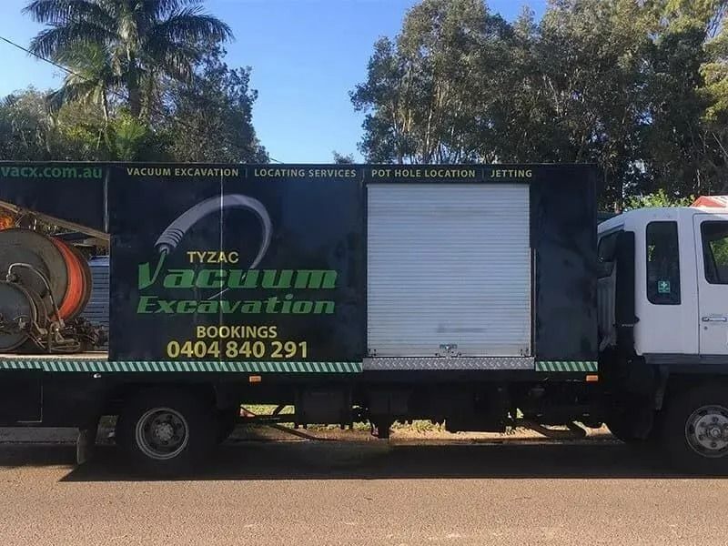 Vacuum Excavation Truck With Company Logo Parked on a Street — Tyzac Group in Beerwah, QLD