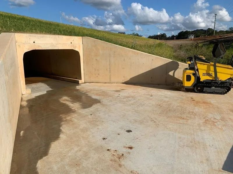 Concrete Tunnel Entrance With a Small Yellow Tracked Vehicle — Tyzac Group in Beerwah, QLD