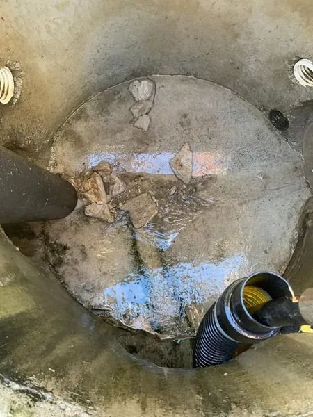 Inside View of a Concrete Container With Debris and Hoses — Tyzac Group in Beerwah, QLD