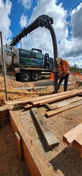 Construction Site: Vacuum Truck and Worker Removing Material — Tyzac Group in Beerwah, QLD