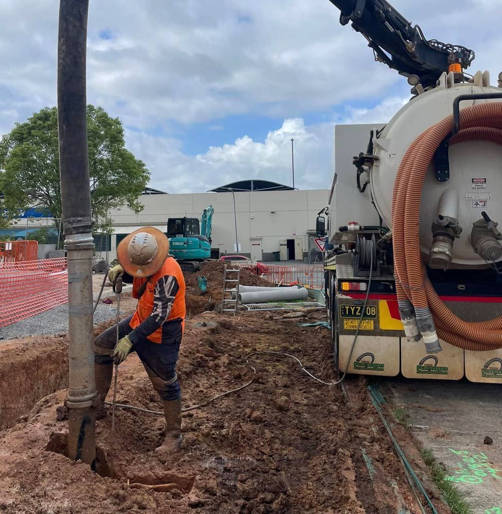 Construction Worker Operating Equipment in a Trench — Tyzac Group in Beerwah, QLD
