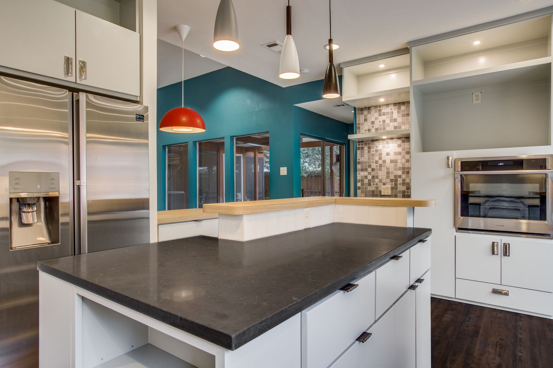 There is a large island in the middle of the kitchen.