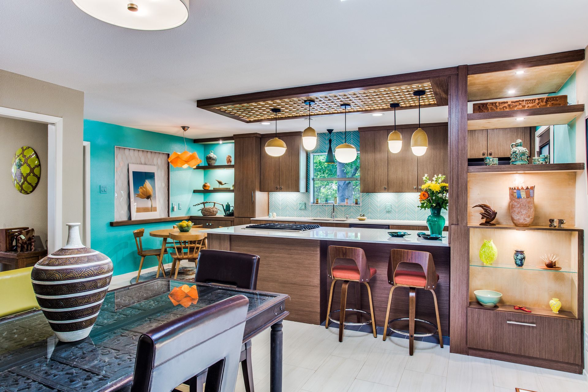 A kitchen with a table and chairs in it