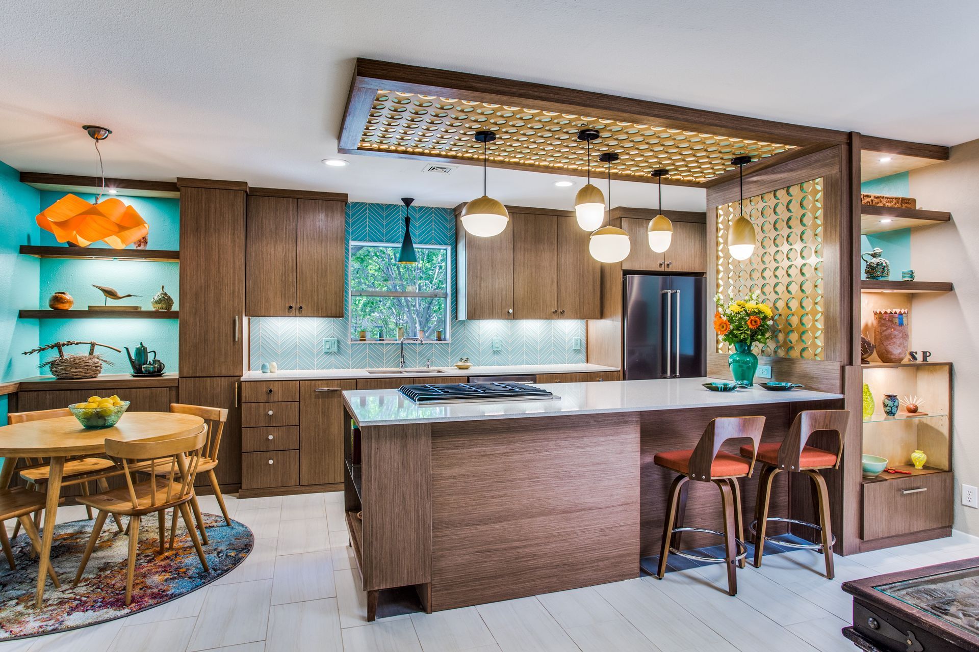 A kitchen with wooden cabinets and a large island in the middle.