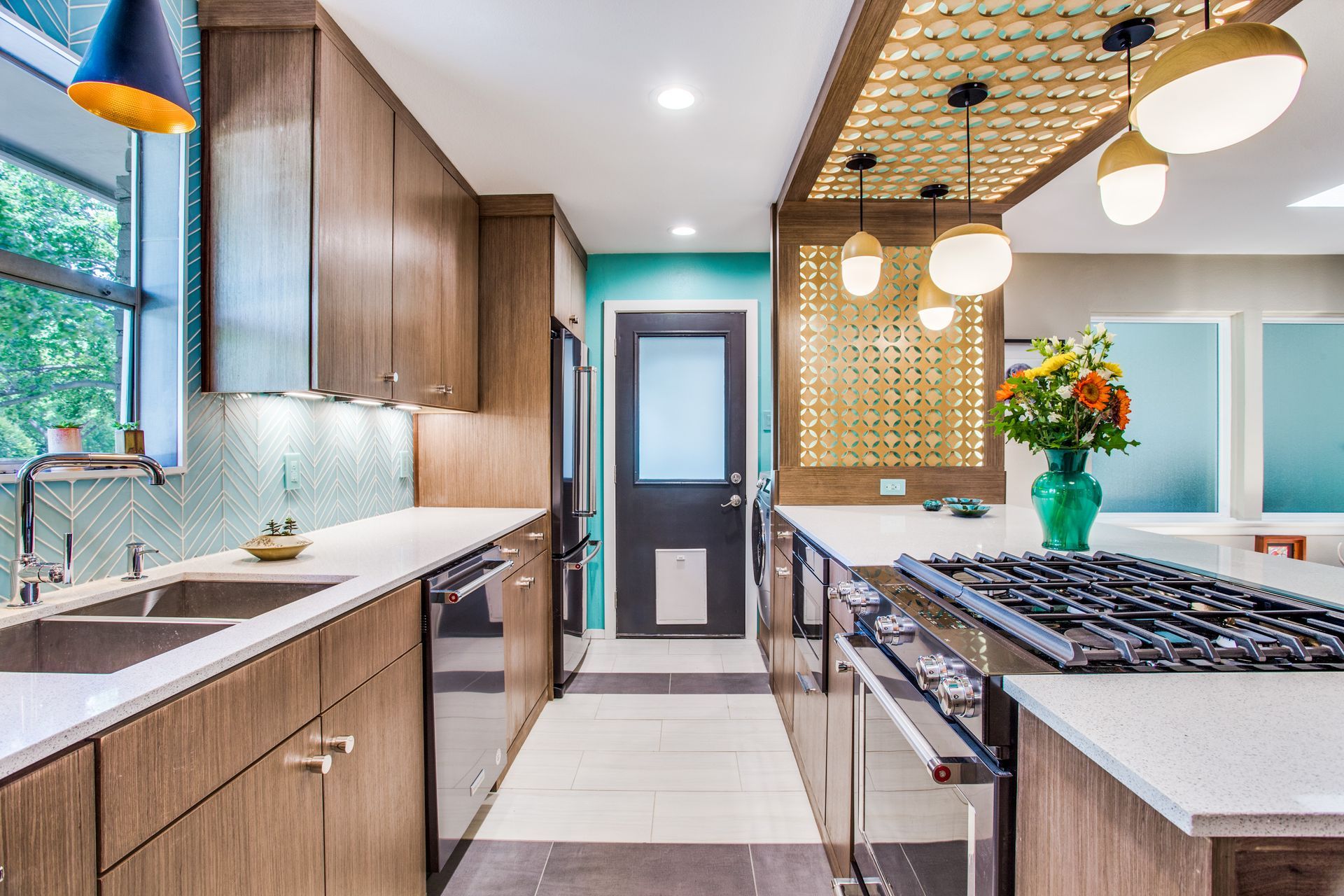 A kitchen with stainless steel appliances , wooden cabinets and a stove top oven.