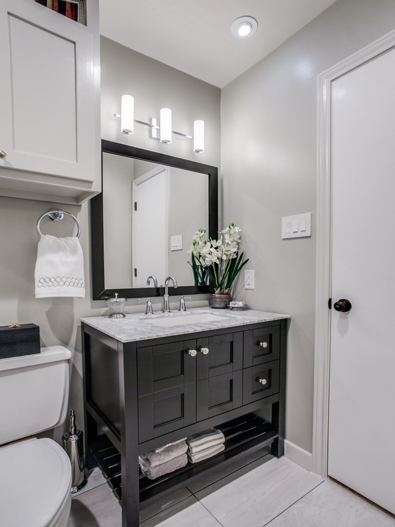 A bathroom with a sink and a window.