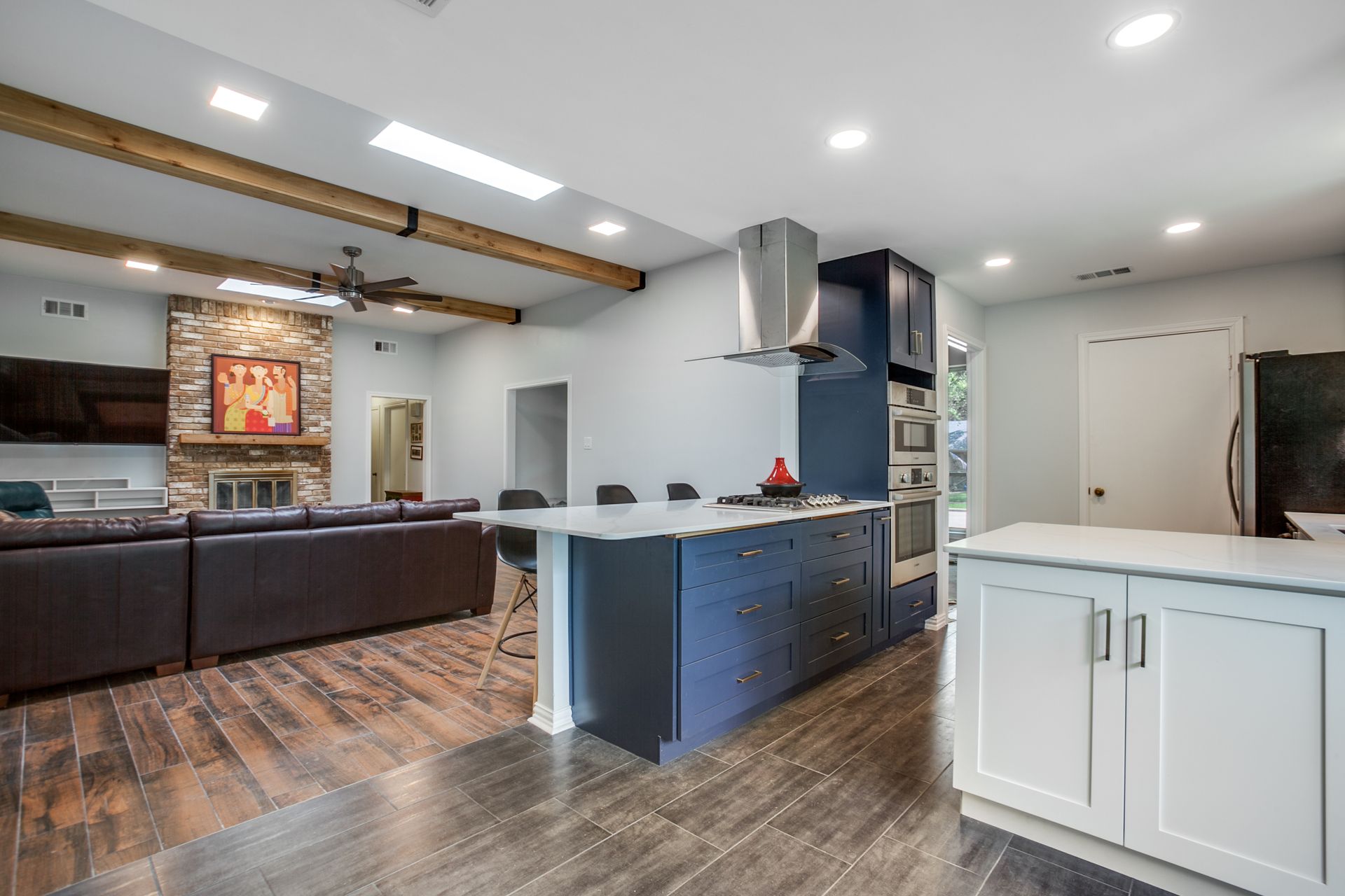 A kitchen with a large island in the middle of the room.