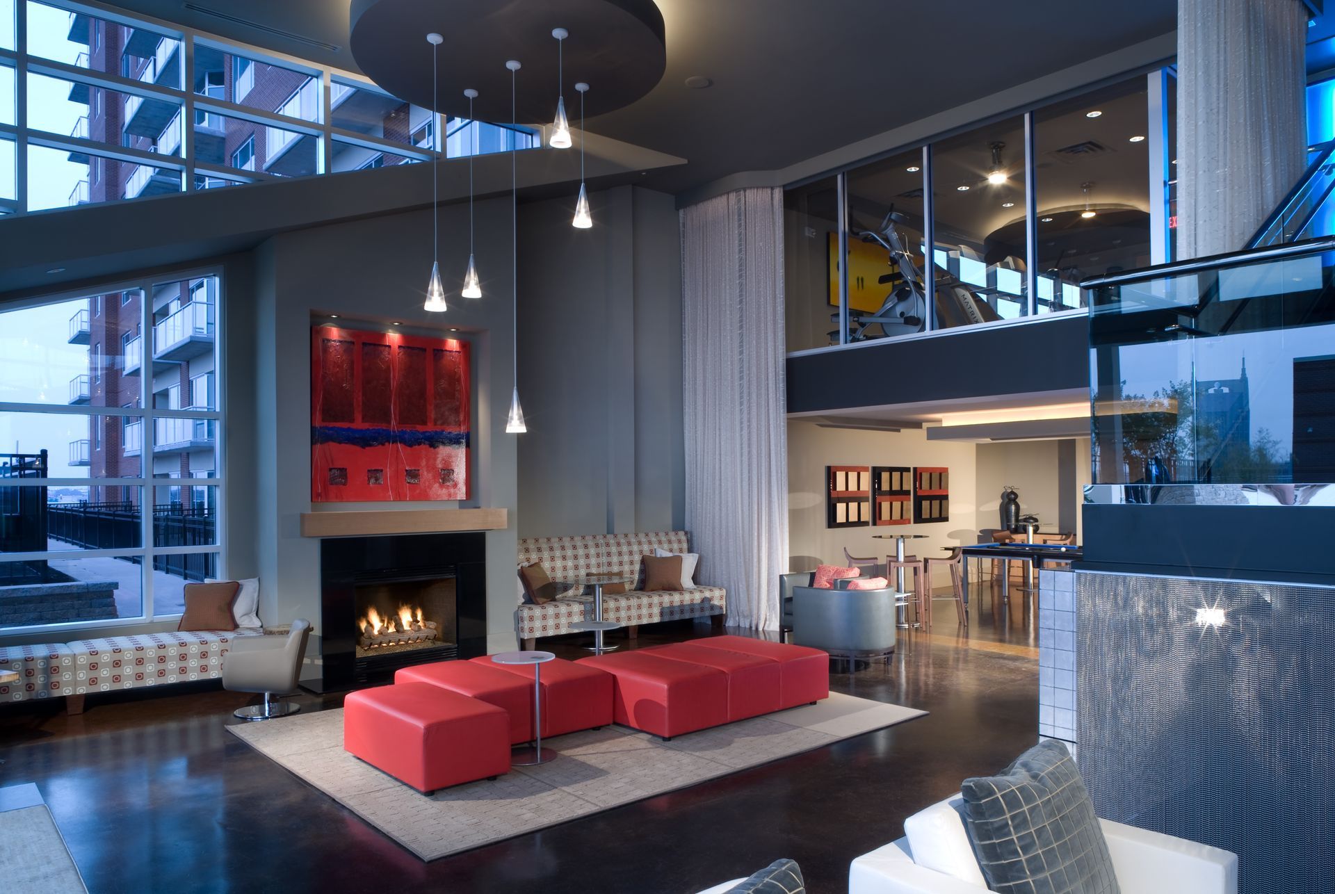 A large lobby with a lot of chairs and tables