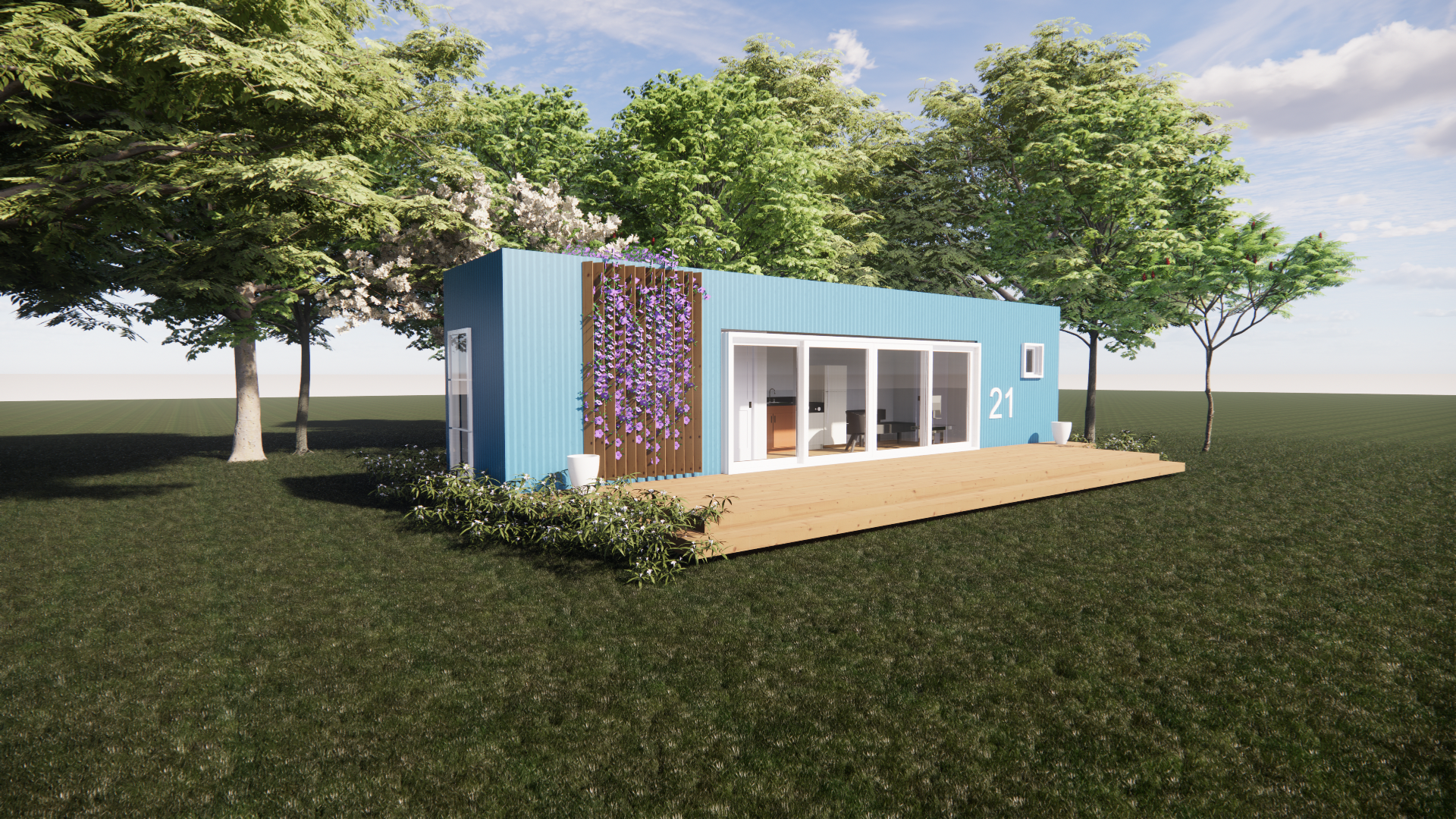 A blue house is sitting in the middle of a grassy field surrounded by trees.