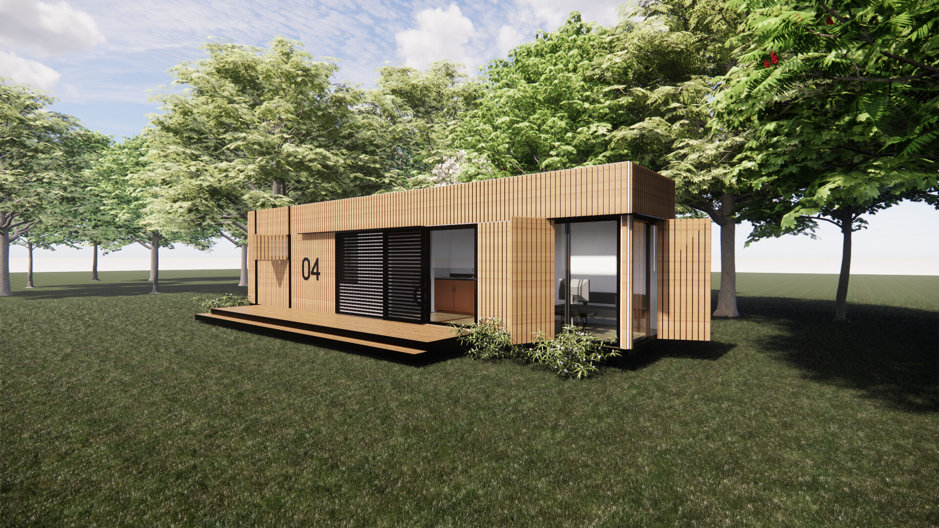 A shipping container  house is sitting in the middle of a grassy field surrounded by trees.