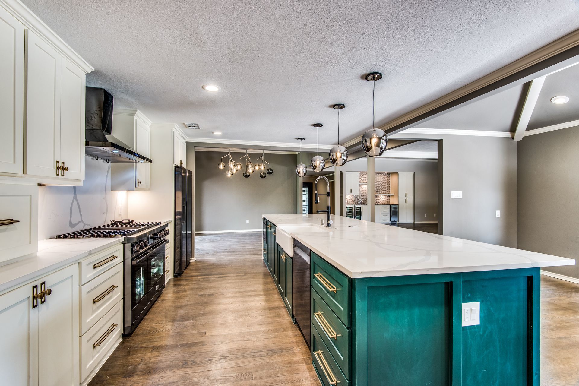 A kitchen with a large island in the middle of it.