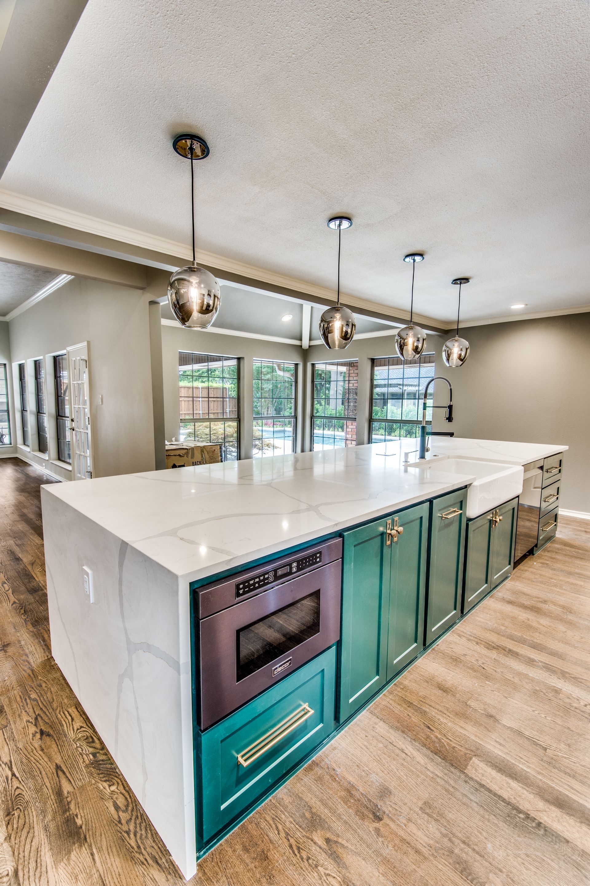 There is a large island in the middle of the kitchen.