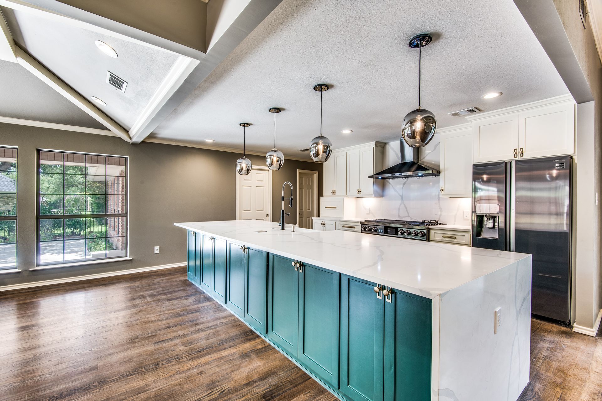 There is a large island in the middle of the kitchen.