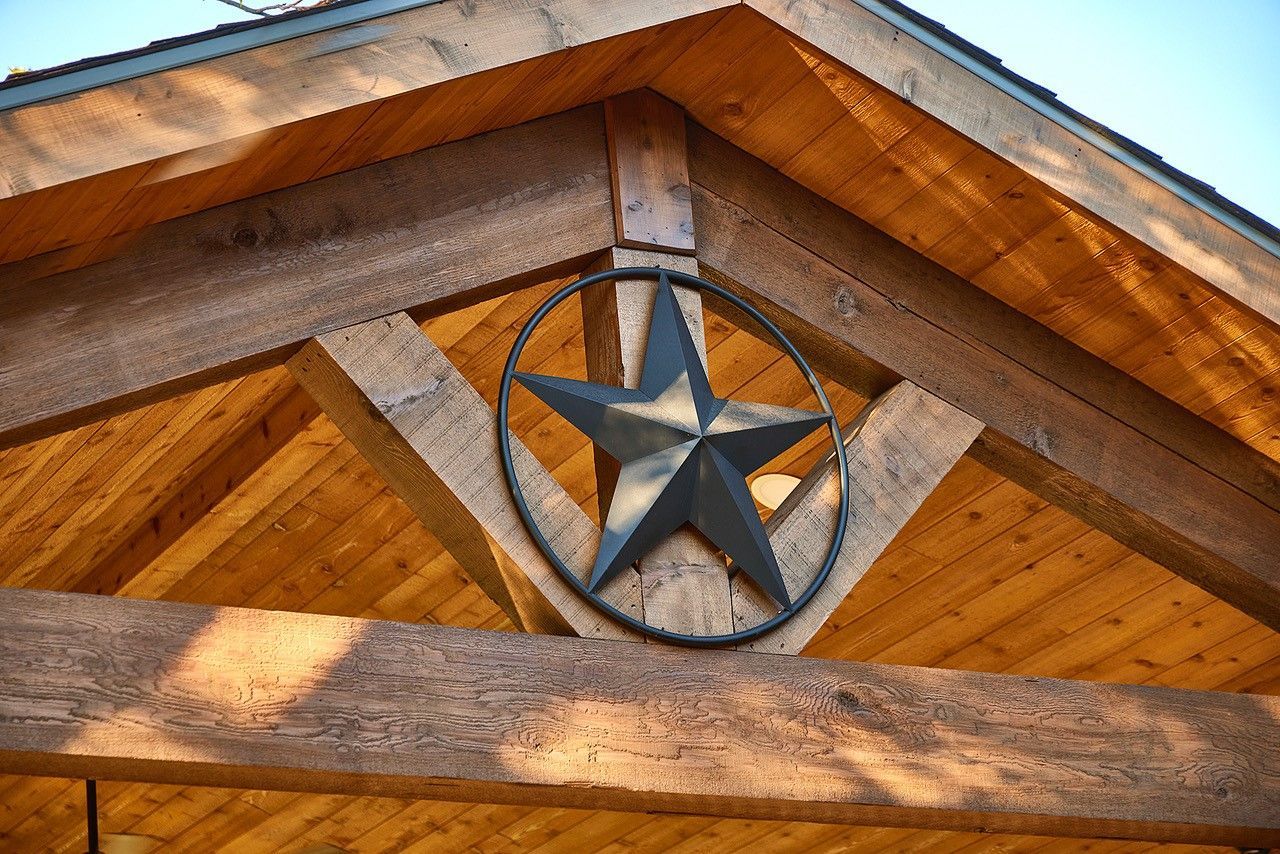 A wooden patio remodel with a star on it